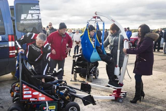 He was hoisted into his specially-modified wheelchair
