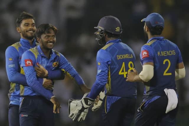 Sri Lanka's Akila Dananjaya, second left, celebrates the dismissal of England's Ben Stokes during the fifth one-day international in Colombo on Tuesday. Picture: AP/Eranga Jayawardena