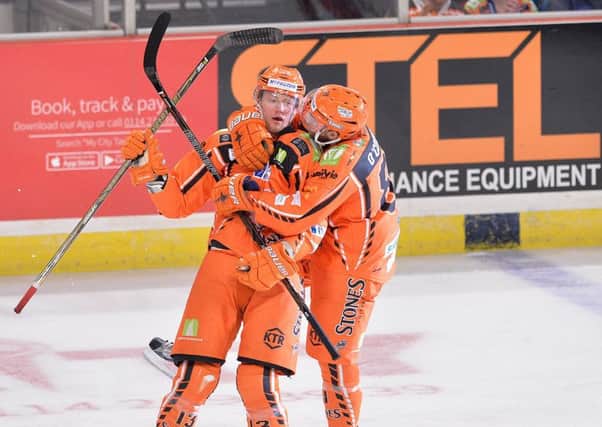 YOU BEAUTY: Sheffield Steelers' Davey Phillips celebrates a goal with defensive team-mate, Ben O'Connor. Picture: Dean Woolley.
