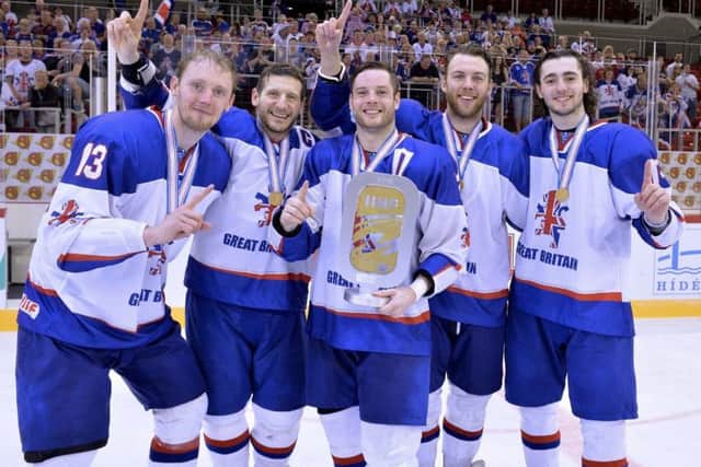 Davey Phillips, left, celebrates Great Britain's stunning World Championships gold medal triumph in April with Sheffield Steelers' team-mates  Jonathan Phillips, Robert Dowd, Ben O'Connor and Liam Kirk.