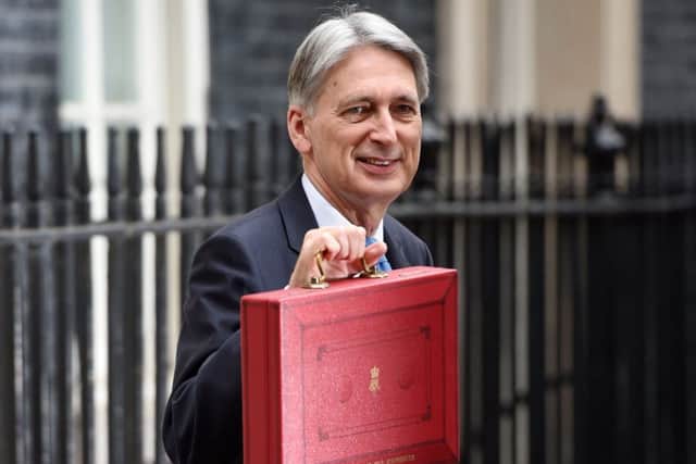 Chancellor Philip Hammond holding his red ministerial box outside 11 Downing Street, London. Picture: Joe Giddens/PA Wire