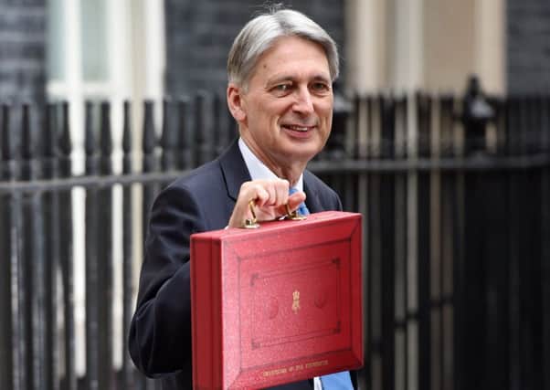 Chancellor Philip Hammond holding his red ministerial box outside 11 Downing Street, London. Picture: Joe Giddens/PA Wire