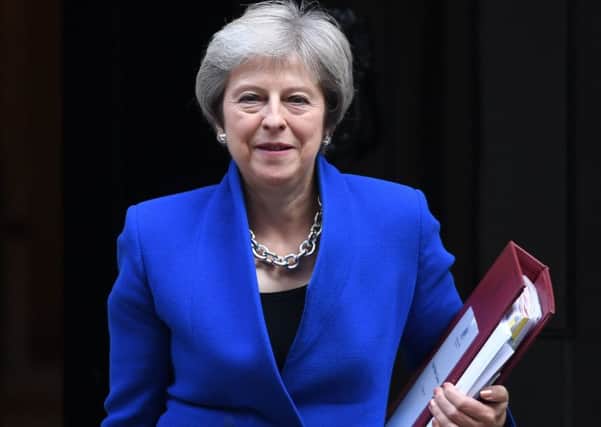 Theresa May has been described by critics as Britain's worst post-war prime minister. Do you agree?