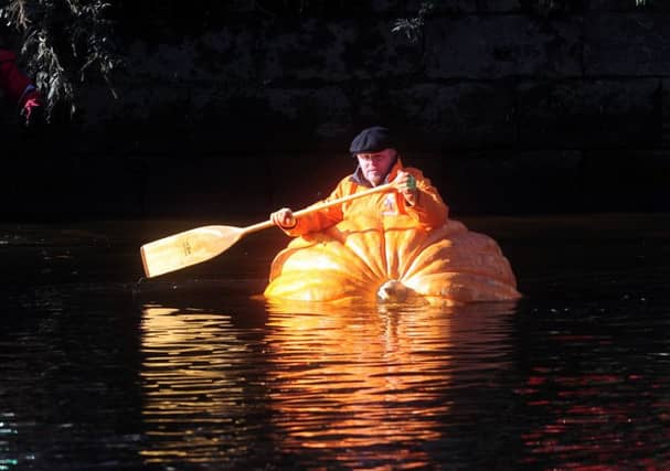 Tom Pearcy in his pumpkin boat on the River Ouse, York. Picture by Simon Hulme
