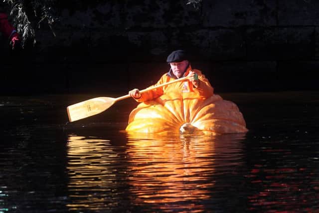 Tom Pearcy in his pumpkin boat on the River Ouse, York. Picture by Simon Hulme