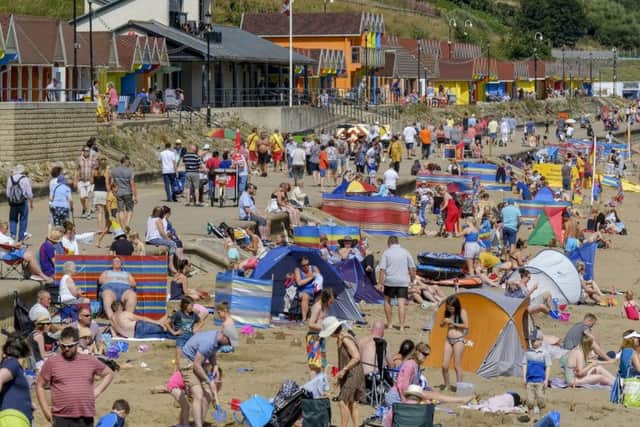 Â©Tony Bartholomew
07802 400651
mail@bartpics.co.uk

5th August 2018

Scarborough's North Bay on a busy weekend at the Yorkshire Coast as people headed for the beach for sea breezes and a paddle to keep them cool.