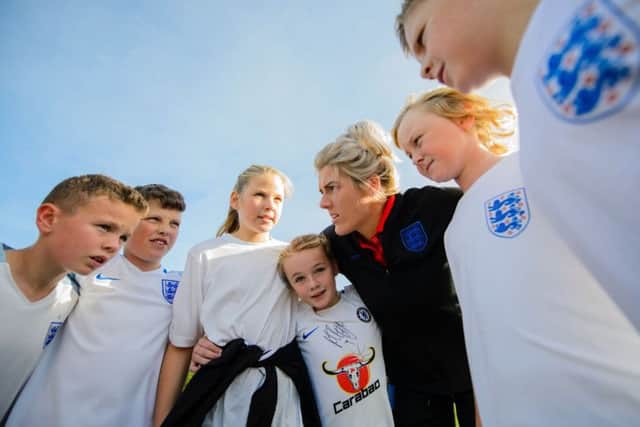 Back to school: Millie Bright gives a coaching clinic to pupils at her former Killamarsh school.