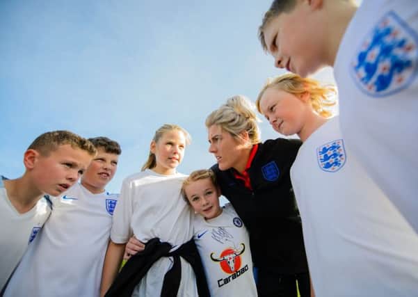 Back to school: Millie Bright gives a coaching clinic to pupils at her former Killamarsh school.