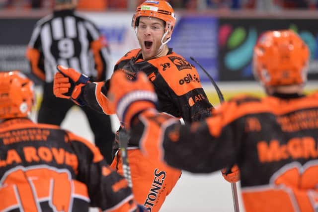 HERO: Ben O'Connor celebrates with his Sheffield Steelers' team-mates after scoring the game-winning goal against Coventry Blaze in overtime. Picture: Dean Woolley.