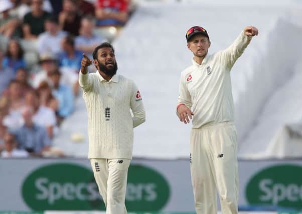 England's bowler Adil Rashid (left) talks with England captain Joe Root in the Test match at Edgbaston against India earlier this summer. Picture: Nick Potts/PA