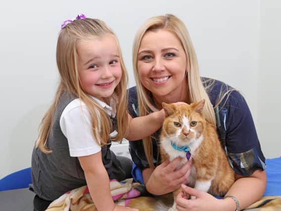 Victoria Lee, her daughter Sophia and Louis the cat.