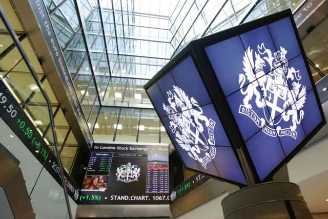 File photo dated 20/03/15 of an information screen displaying the FTSE 100 at the London Stock Exchange, as the owner of the LSE saw its profits jump by almost a third in the first six months of the year, driven by its acquisition of a US rival. PRESS ASSOCIATION Photo. Issue date: Wednesday August 5, 2015. The group said adjusted operating profits lifted 27% to Â£366.1 million year-on-year in the first half, buoyed by the Â£1.6 billion takeover in June 2014 of Seattle-based index complier and asset manager Frank Russell, which it combined with its own FTSE index business. See PA story CITY LSE. Photo credit should read: Yui Mok/PA Wire