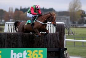 Definitly Red ridden by Danny Cook wins the bet365 Charlie Hall Chase.