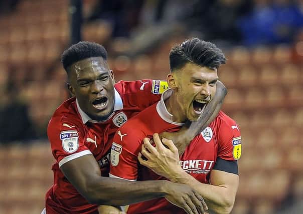 PERFECT TIMING: Kieffer Moore celebrates his late winning goal with Dimitri Cavare. Picture: Scott Merrylees