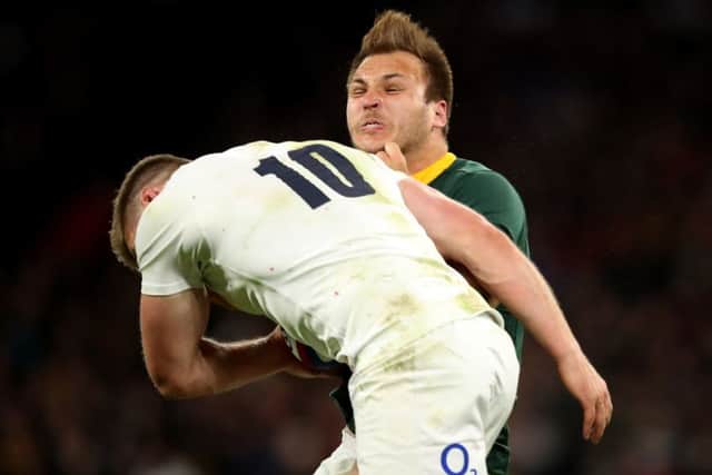 England's Owen Farrell tackles South Africa's Andre Esterhuizen at Twickenham. Picture: Adam Davy/PA