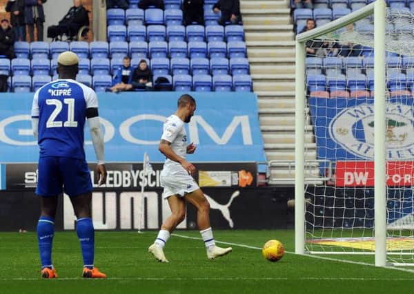 Leeds United's Kemar Roofe taps in what proved the winning goal against Wigan AThletic (Picture: Simon Hulme).