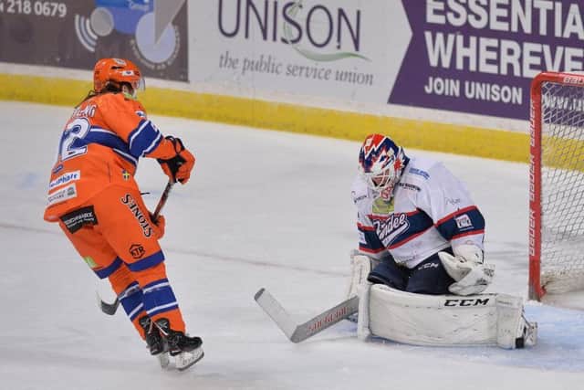 BREAKAWAY: Jonas Westerling pokes the puck through the legs of the Dundee goaltender for a short-handed strike on Saturday. Picture: Dean Woolley.