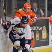 GAME ON: Sheffield Steelers' Rob Dowd battles for possession against Dundee on Saturday night. Picture: Dean Woolley.