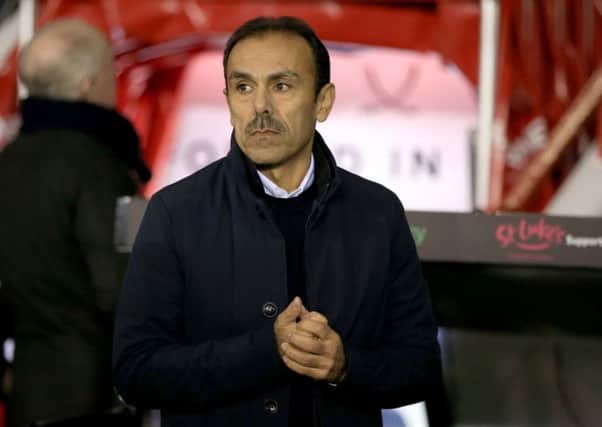 Tough baptism: Sheffield Wednesday manager Jos Luhukay in the Bramall Lane dugout back in January, his first game in charge of the Owls.  (Picture: sportimage)