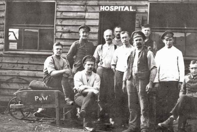 Photo of prisoners outside the Raikeswood Camp hospital. Courtesy of Peter Barry & Charles M Whittaker. (Picture Bruce Rollinson).
