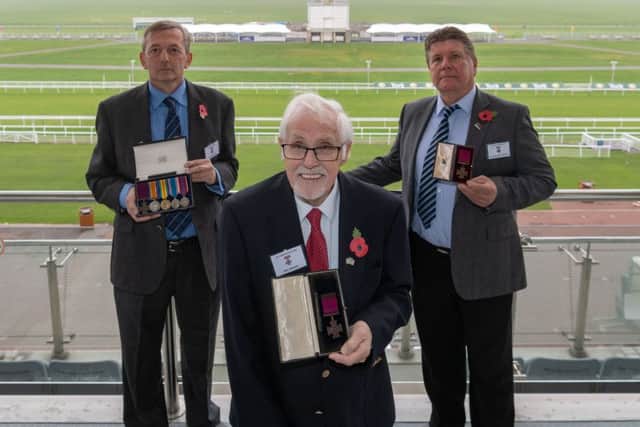 Pictured (left to right) John Harrison, hold the VC for Arther Poulter, Eric Brown, holding the VC for Jack Harrison, and William (Billy) Wilson, hold the VC for John Cunningham, three representatives from families who have been reunited with their Victoria Cross, awarded to their relative who give outstanding bravery whilst serving during WW1.