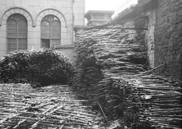 Photo issued by the Imperial War Museum of 32,000 destroyed German rifles. The image is amongst a series of 130 black and white rarely seen photographs that are going on display as part of an exhibition on the aftermath of the First World War conflict.