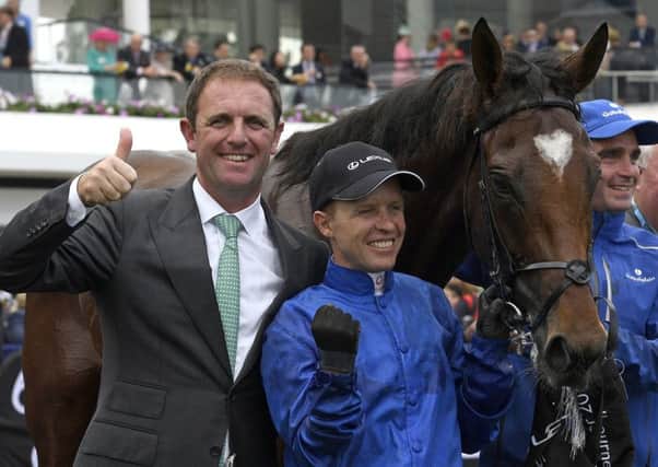 Trainer Charlie Appleby and jockey Kerrin McEvoy celebrate Cross Counter's Melbourne Cup win.