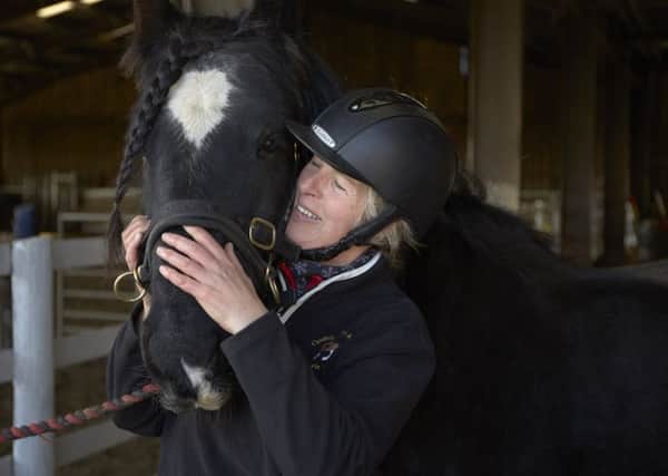 Vet Clare Tapsfield-Wright with her horse Spencer.