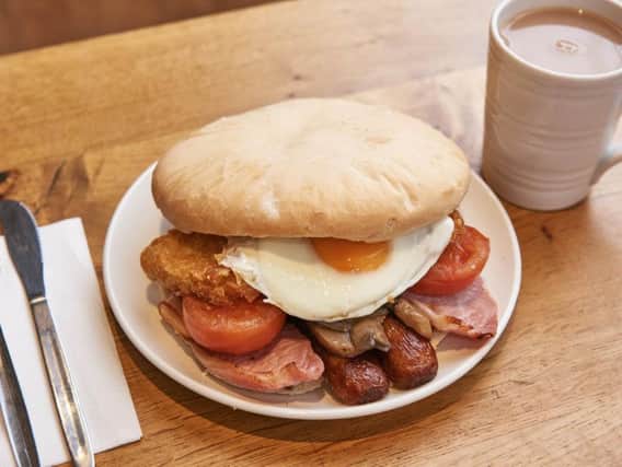 The butty is packed with the cooked breakfast essentials including two rashers of back bacon, two hash browns, two pork sausages, baked beans, mushrooms, fried egg and agrilled tomato.