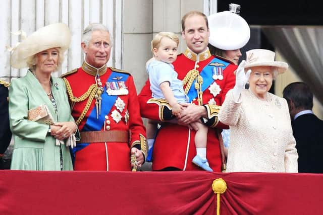 The Duchess of Cornwall, the Prince of Wales, Prince George, the Duke and Duchess of Cambridge and Queen Elizabeth II on the balcony at Buckingham Palace following Trooping the Colour at Horse Guards Parade, London.
