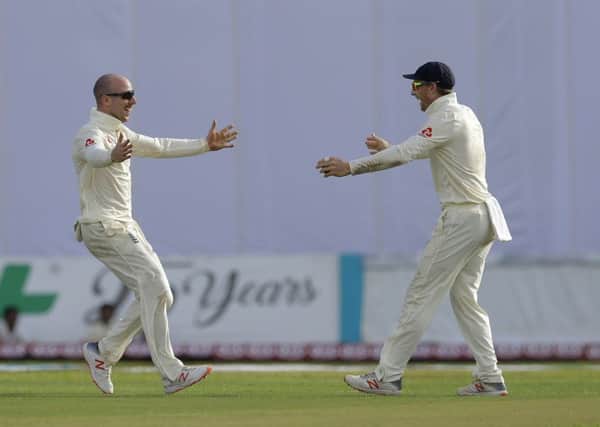 Old pals act: Jack Leach and Jos Buttler (Pictures: AP)
