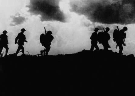 British troops in silhouette march towards trenches near Ypres at the Western Front during the First World War which will be remembered this weekend.