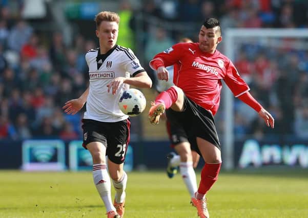 Cauley Woodrow, left, playing for parent club Fulham last year, has made just two substitute appearances for Barnsley.