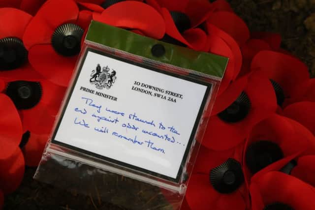 The message on the wreath that Theresa May left on the grave of Private George Ellison, the Leeds soldier who was killed 90 minutes before the signing of the Armistice.