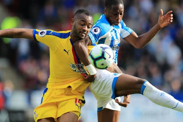 Crystal Palace's Jordan Ayew (left) and Huddersfield Town's Terence Kongolo in action (PIcture: PA)