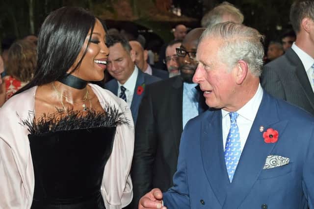 The Prince of Wales speaks with Naomi Campbell during a reception at The British Deputy High Commioner's Residence in Nigeria, on day eight of his trip to west Africa with the Duchess of Cornwall.
