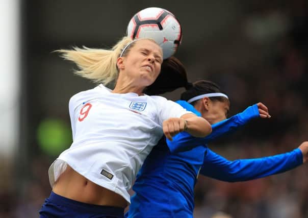England's Rachel Daly (left), who returns to her native Yorkshire this Sunday, jumps with Brazil's Andrea Alves during the International Friendly at Meadow Lane, Nottingham. (Picture: Mike Egerton/PA Wire)