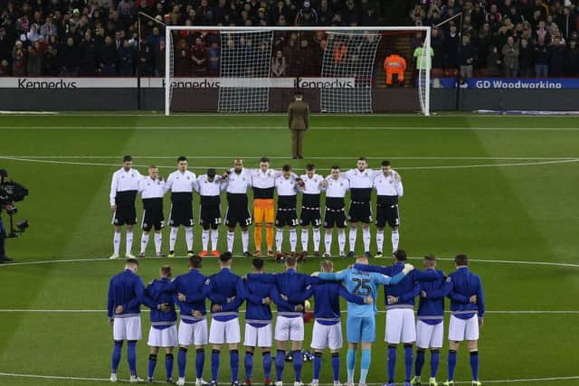 RESPECT: Players from both Sheffield United and Sheffield Wednesday line up for a minutes silence at Bramall Lane. Picture: James Wilson/Sportimage