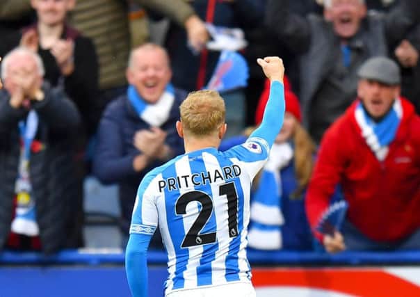 On target: Huddersfield Town's Alex Pritchard celebrates scoring his side's early goal.
