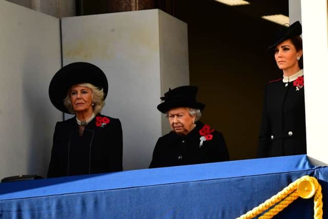 The Queen, pictured with the Duchess of Cornwall and Duchess of Cambridge, watches the service of remembrance at the Cenotaph.