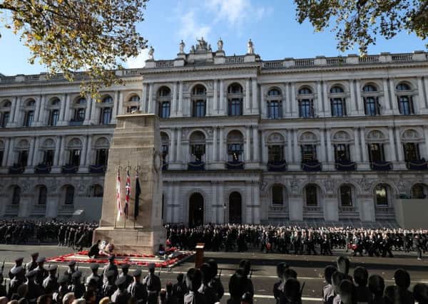 The veterans march past the Cenotaph during the remembrance service in Whitehall, central London, on the 100th anniversary of the signing of the Armistice which marked the end of the First World War.