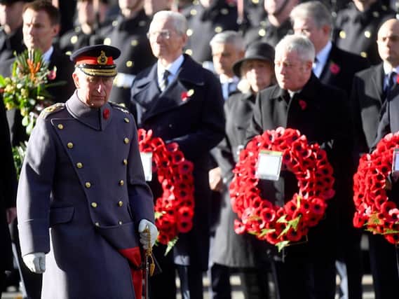 The Prince of Wales lays a wreath during the remembrance service at the Cenotaph memorial in Whitehall, central London, on the 100th anniversary of the signing of the Armistice which marked the end of the First World War.