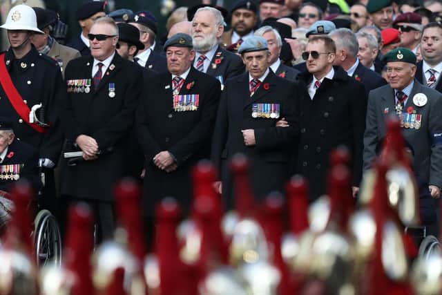 Veterans attend the remembrance service at the Cenotaph memorial in Whitehall, central London, on the 100th anniversary of the signing of the Armistice which marked the end of the First World War.