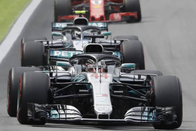 Mercedes driver Lewis Hamilton, of Britain, steers his car followed by team-mate Valtteri Bottas, in the Brazilian Grand Prix.