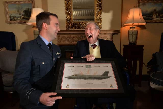Basil Fish, 96, a veteran of the RAF 617 (Dambusters) squadron, being feted by present-day members of the unit, on the anniversary of the sinking of the German battleship Tirpitz in 1944.
