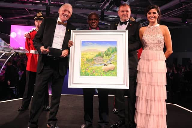 Sir Gary Verity presents a token of thanks to Dr John Sentamu, who has announced he is retiring as the Archbishop of York in June 2020. Pictured here alongside BBC Look North presenters Harry Gration and Amy Garcia. Picture by Simon Hulme.
