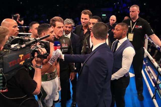 Amir Khan shrugs off Kell Brook in a brief shouting match at Khan's fight in September. (Pic: Press Association)