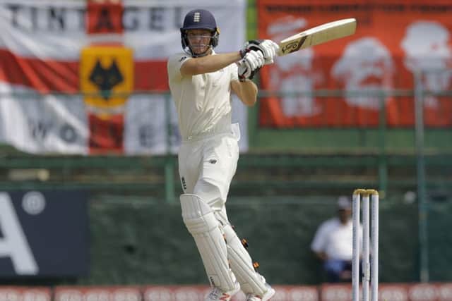 England's Joss Buttler pulls one to the leg side during the first day of the second Test at Pallekele. Picture: AP/Eranga Jayawardena