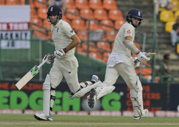 Last stand: England's James Anderson, left, and Sam Curran, right, run between wickets during the first day of the second test. (AP Photo/Eranga Jayawardena)