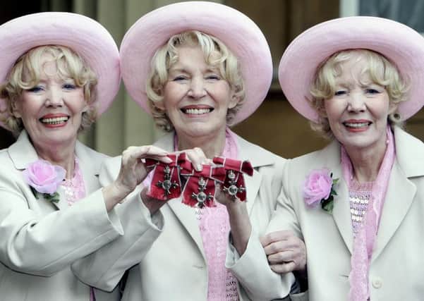 FAMILY ENTERTAINERS:  Babs Beverley, left, with sisters Joy, centre, and Teddie at Buckingham Palace after receiving their MBEs from the Queen in 2006.